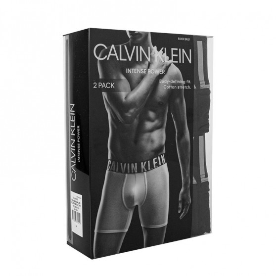 2PACK Fekete Calvin Klein férfi slip alsónadrág (NB2601A-UB1)