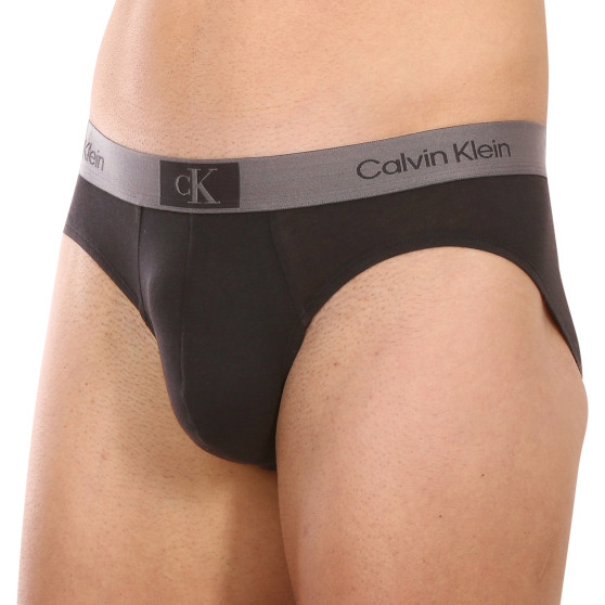 7PACK Fekete Calvin Klein férfi slip alsónadrág (NB3581A-CDB)