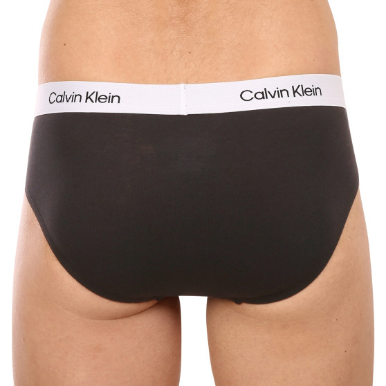 7PACK Fekete Calvin Klein férfi slip alsónadrág (NB3581A-CDB)