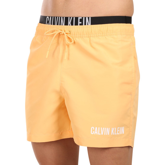 Férfi fürdőruha Calvin Klein narancs (KM0KM00992-SAN)