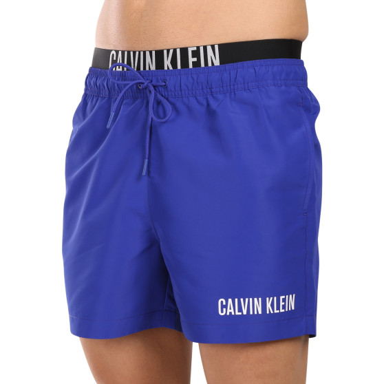 Férfi fürdőruha Calvin Klein kék (KM0KM00992-C7N)